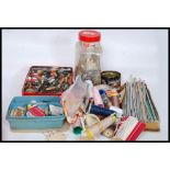 A collection of vintage sewing and needl