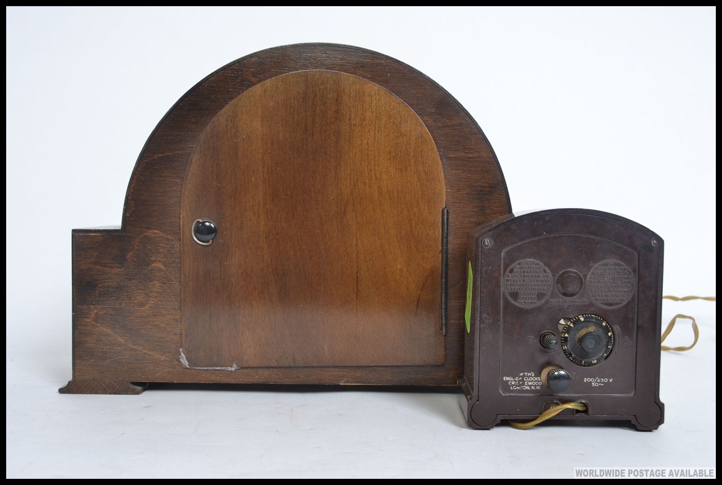 A mid century Smiths oak cased mantle clock along with a smaller Smiths Bakelite electric clock. - Image 2 of 4