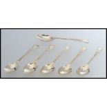 A set of 6 silver hallmarked spoons having chased scrolled  handles.