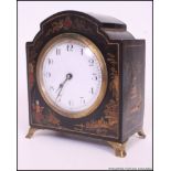 A 1930's Japanese chinoserie decorated mantel clock. French brass movement with enamel face.