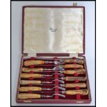 A good quality Harrods of London  cased set of fish knives in original presentation box