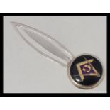 A silver ( stamped 925 ) and white metal enamel topped bookmark with masonic emblem.