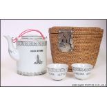 A 20th century Chinese ' Pagoda Restaurant ' tea for 2 service in whicker basket.