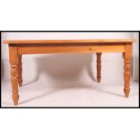 A very large contemporary country style pine dining table.