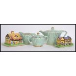 A Sadler Art Deco ceramic Teapot with matching water pot and creamer,