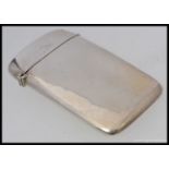 A good quality silver hallmarked cigarette case being bow shaped for the pocket with hinged lid by