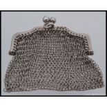 A silver hallmarked ladies sovereign mesh purse with chain. Birmingham hallmarks for 1915.