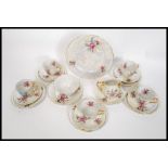 A 20th century Czech lusterware tea service to include cups,