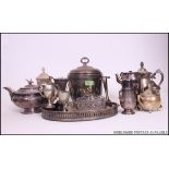 A collection of silver plated wares to include ice bucket, teapots, sugar sifter, creamers, ashtray,