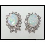 A pair of 925 silver CZ and Opalite earrings in a stylised Art Nouveau crown setting. Measures 1.