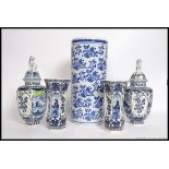 A collection of Delft blue and white ceramics to include vases and lidded vases by Royal Sphinx.