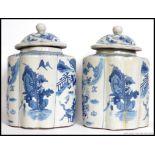 A large pair of Chinese Kang-xi style blue and white ginger - spice jars.