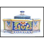 An Italian Faience ceramic inkwell, complete with inner well and lid.