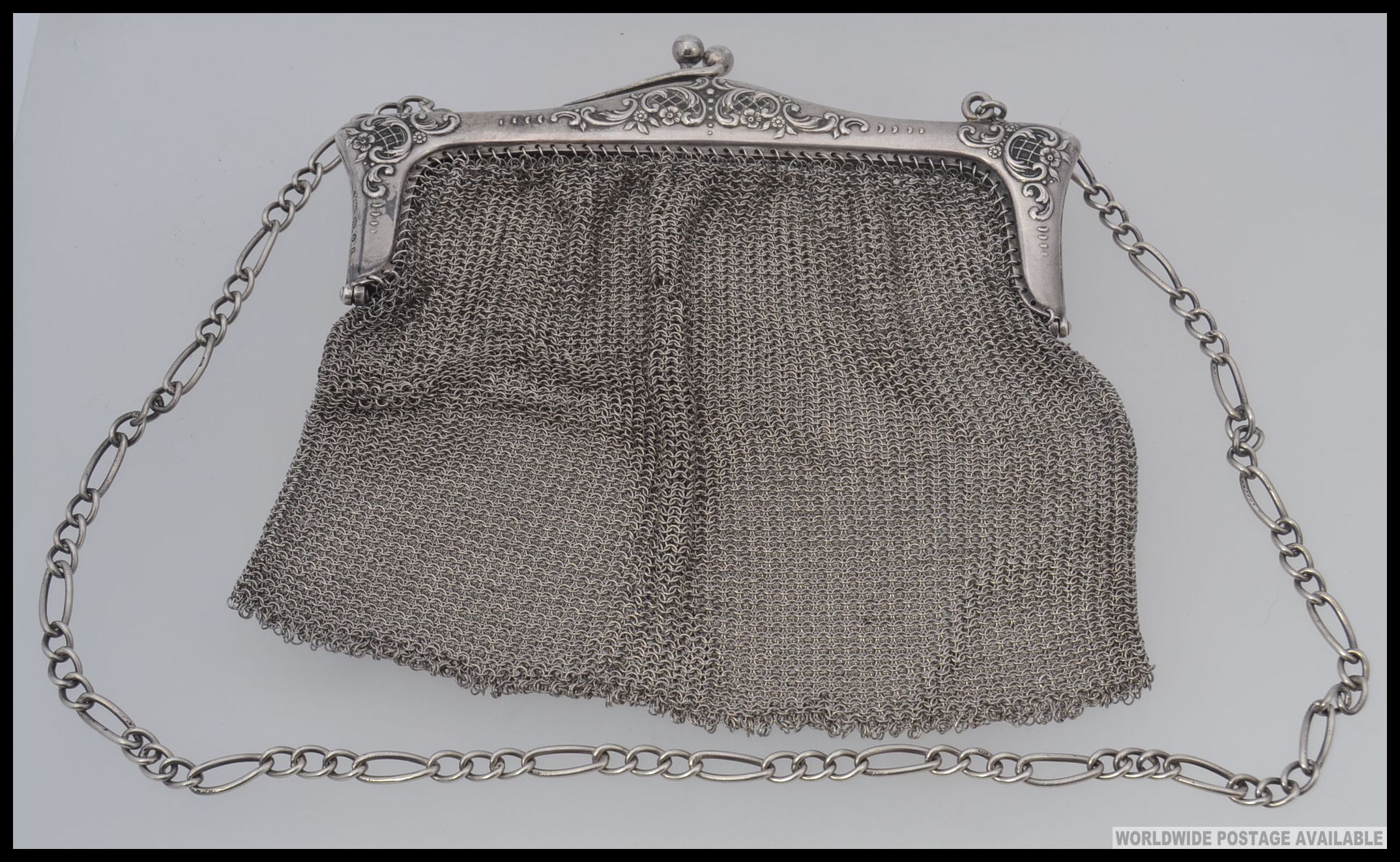 A silver hallmarked ladies large mesh purse and chain.