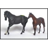 A BESWICK FIGURE OF A BLACK HORSE with white blaze and one white sock, matte finish,