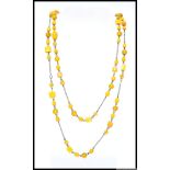 A 1930s Czech long mustard art glass bead necklace. Length 52 inches. Weight 60g.