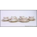 A set of 6 Staffordshire ceramic trio's in a chintz - part tea service comprising cups, saucers,