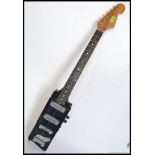 A vintage Bo Diddley style rectangular electric six string guitar,
