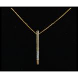A 9ct gold and diamond drop pendant set on a 9ct box linked necklace chain. Total weight 3.