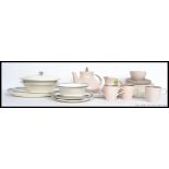 A part Poole dinner service along with a part Midwinter Stylecraft service