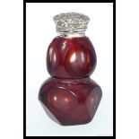 A Victorian style ruby glass and 925 sterling silver topped perfume bottle.