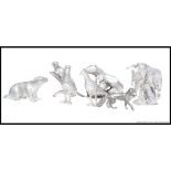 A collection of white metal animal ornaments of decorative form being well crafted.