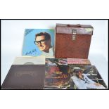A collection of 27 Lp's / records to include Beatles albums x 2 set in a faux skin record case.