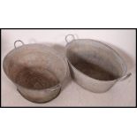 Two 20th century vintage Industrial galvanised metal - tin baths,