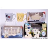 2  opened Lurpak ceramic toast racks complete in the presentation packaging together with an