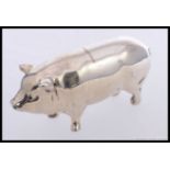 A silver hallmarked large pig figurine.