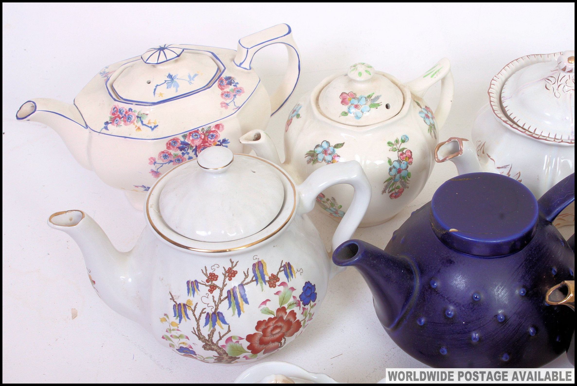 A large collection of teapots to include various shapes and patterns. - Image 2 of 3