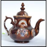 A large  Mearshaum  type  Bargeware majolica pottery teapot.