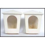 A matching pair of wall pockets / light fixtures, shaped like lanterns stamped to rear SylvaC.