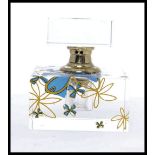 A 20th century Art Deco style glass perfume bottle - scent bottle of cut glass with bow and ribbon