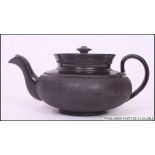 An early 19th century black basalt ware teapot by Cyples.