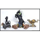 A collection of ceramics to include a ceramic study of a horse, Cheetah, cat,