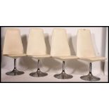 A set of 4 original Borje Johnanson retro leather and chrome tulip dining chairs.