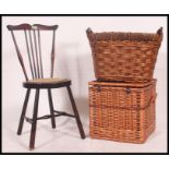 An early 20th century spinning chair along with a vintage whicker hamper and a whisker log basket.