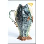 A 19th century rare Four sided Majolica jug pitcher in the form of a fish / sardine.