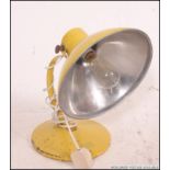 A vintage retro original ' Radiaray ' heat lamp - aluminium construction, in yellow.