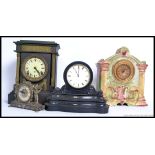 A collection of four late 19th and 20th century clocks to include slate examples,