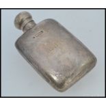 A Victoria silver hallmarked hip flask bearing London hallmarks for 1898 BY W & G Neal.