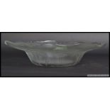A large 20th century pressed glass dish in the style of Lalique,