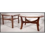 2 1970's retro teak wood Danish influence coffee tables of atomic / sputnik form,