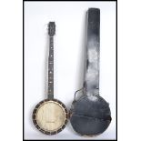 A vintage cased Banjo. Mahogany back with skin having long ebonised neck and head.