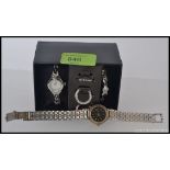 A boxed Ingersol ladies watch with inter changeable facia and straps along with another ladies