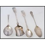 A collection of four silver hallmarked spoons - A shovel shaped caddy Exeter 1851 - makers mark J.