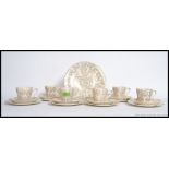 A vintage bone china tea service by Washington, being decorated with 22ct gold,