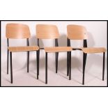 A set of 3 contemporary Industrial style wooden chairs with black legs and ply wood panel seats and
