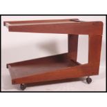 A retro 1960's unusual style low angular tea trolley magazine table with castors to base